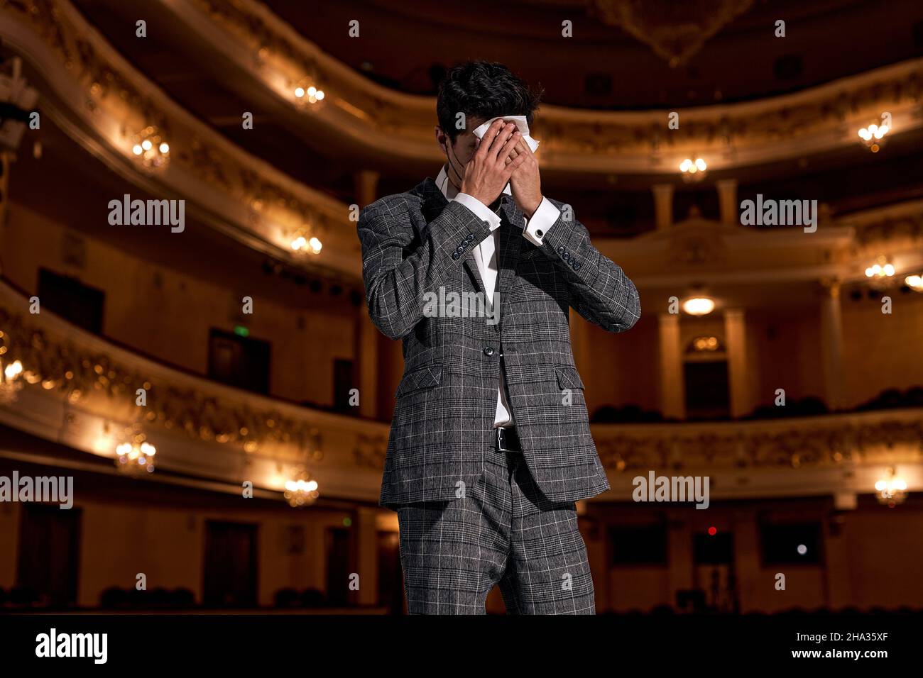 Worried and tired caucasian male in suit suffering from inequality and ...
