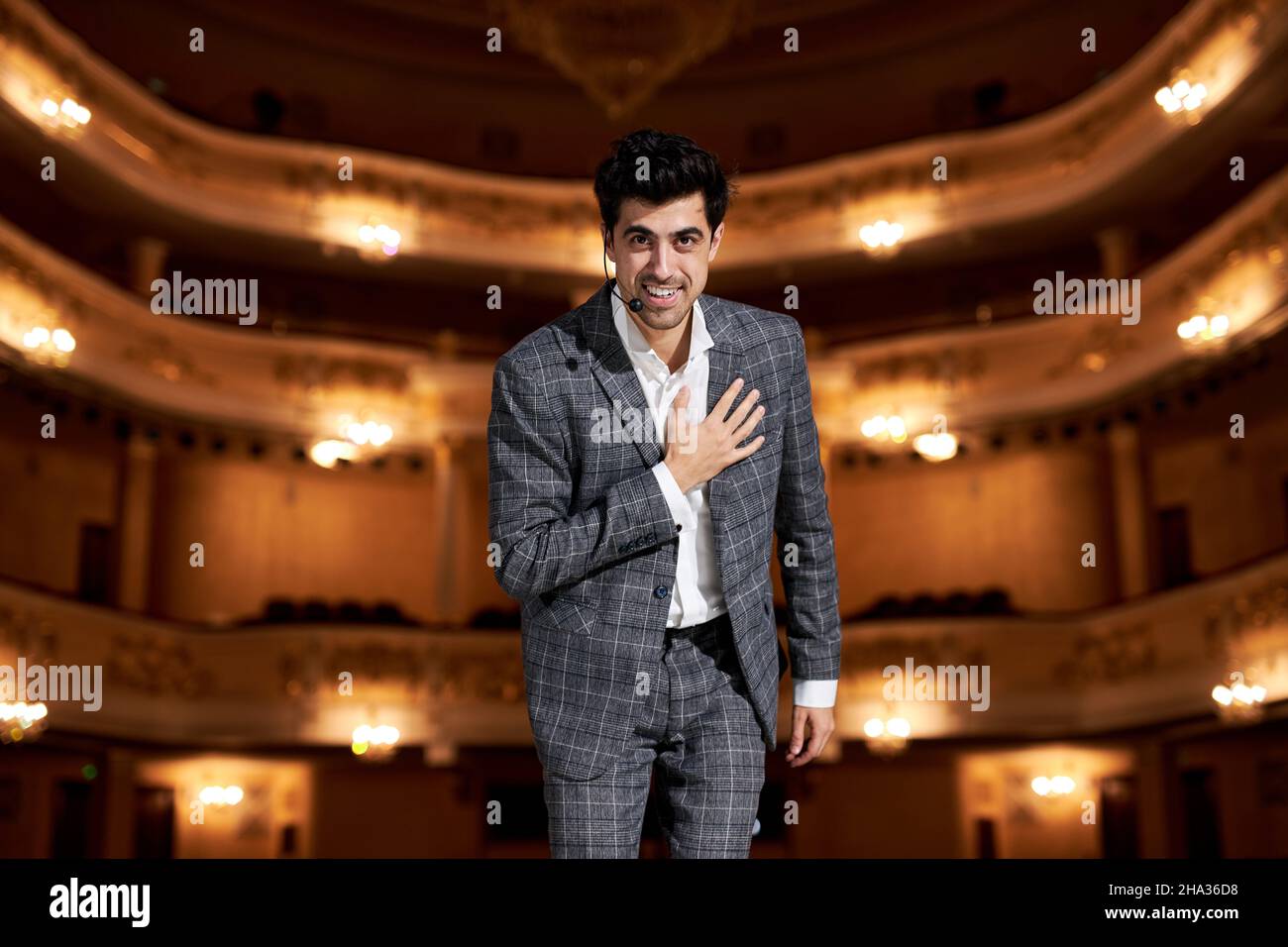 handsome actor bow down after performance, expressing gratitude