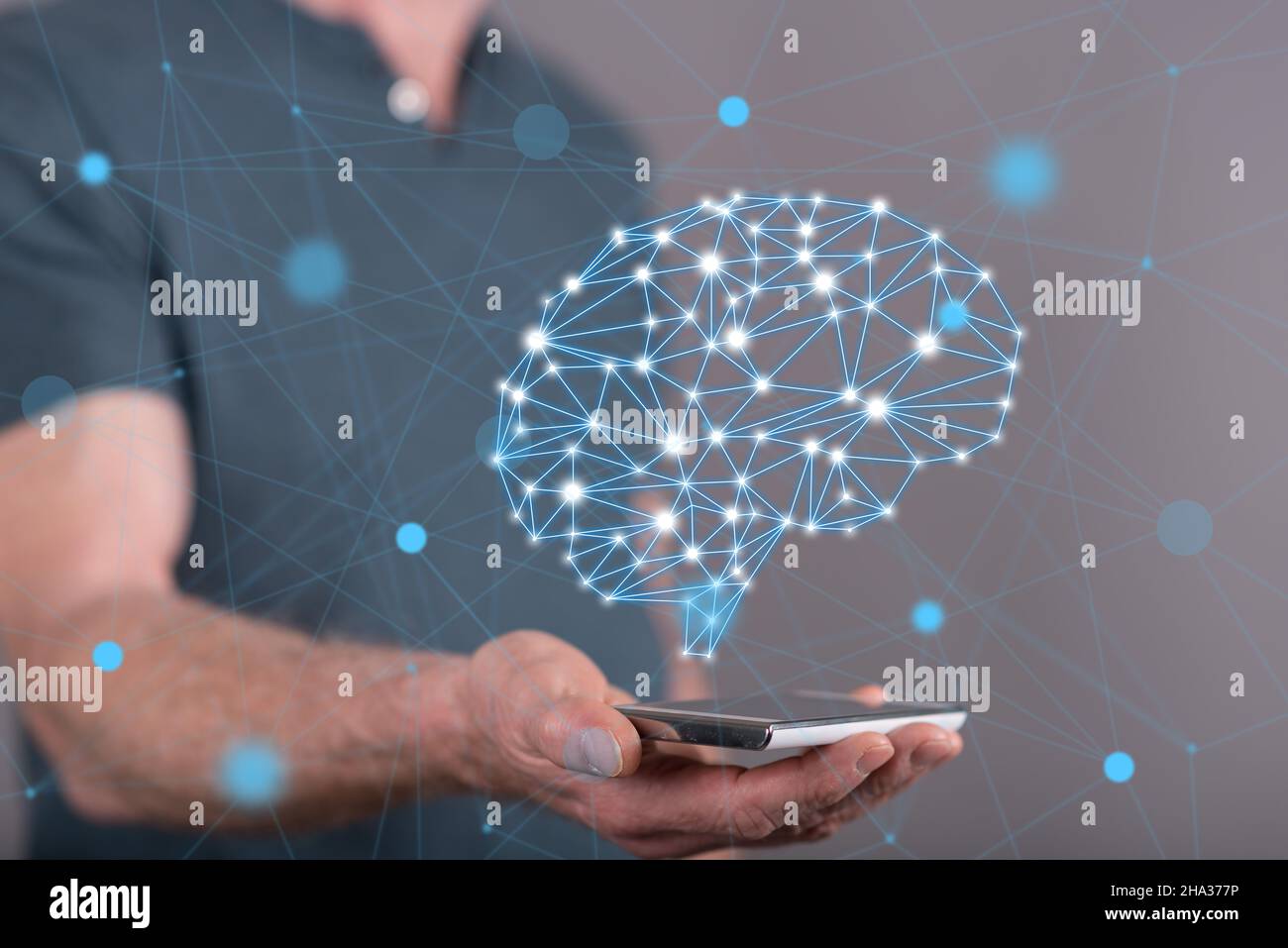 Artificial intelligence concept above a smartphone held by a man in ...