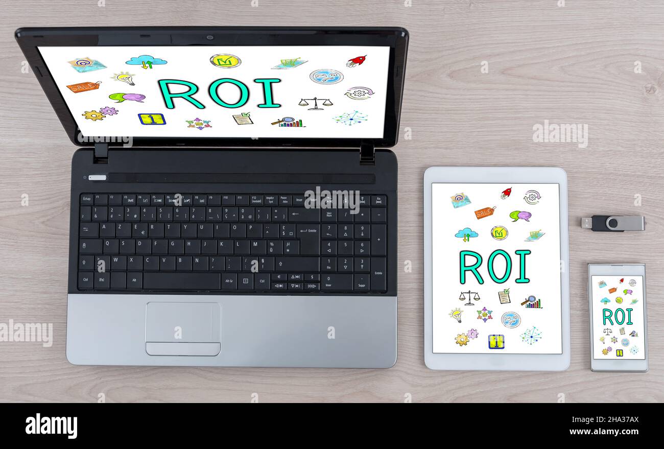 Roi concept shown on different information technology devices Stock Photo