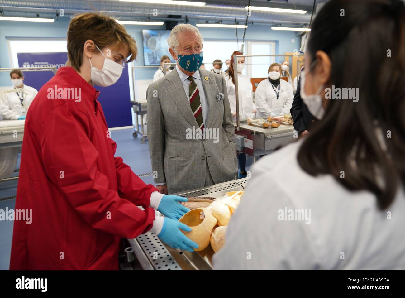 The Prince of Wales talks to students during a visit to open