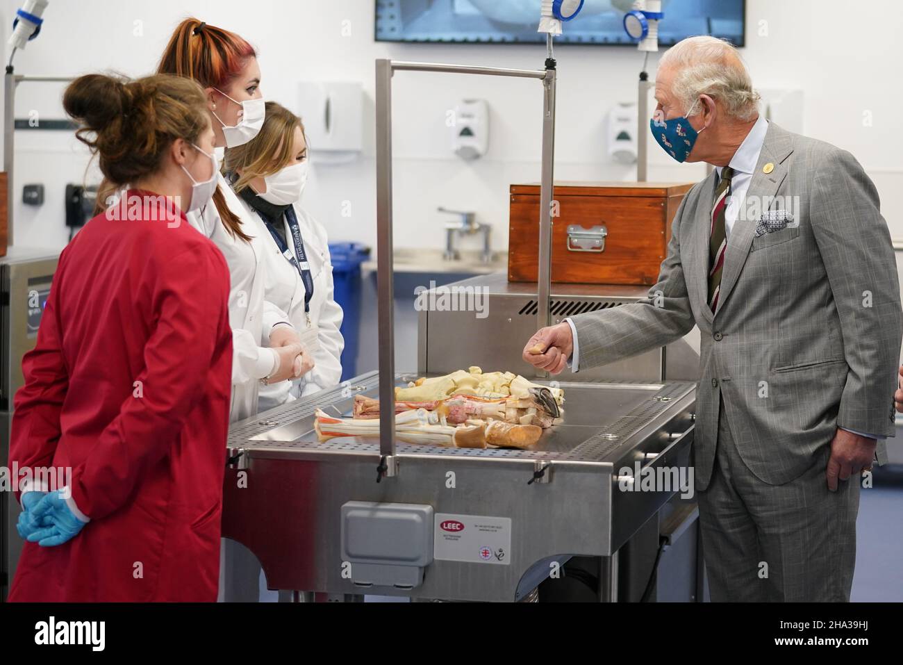 The Prince of Wales talks to students during a visit to open