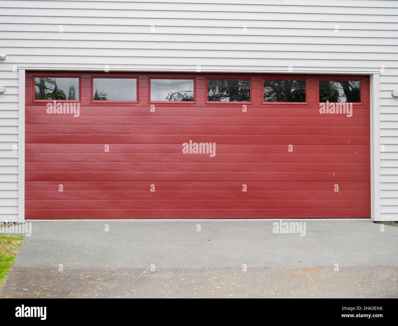 sectional roller garage door with windows Stock Photo Alamy