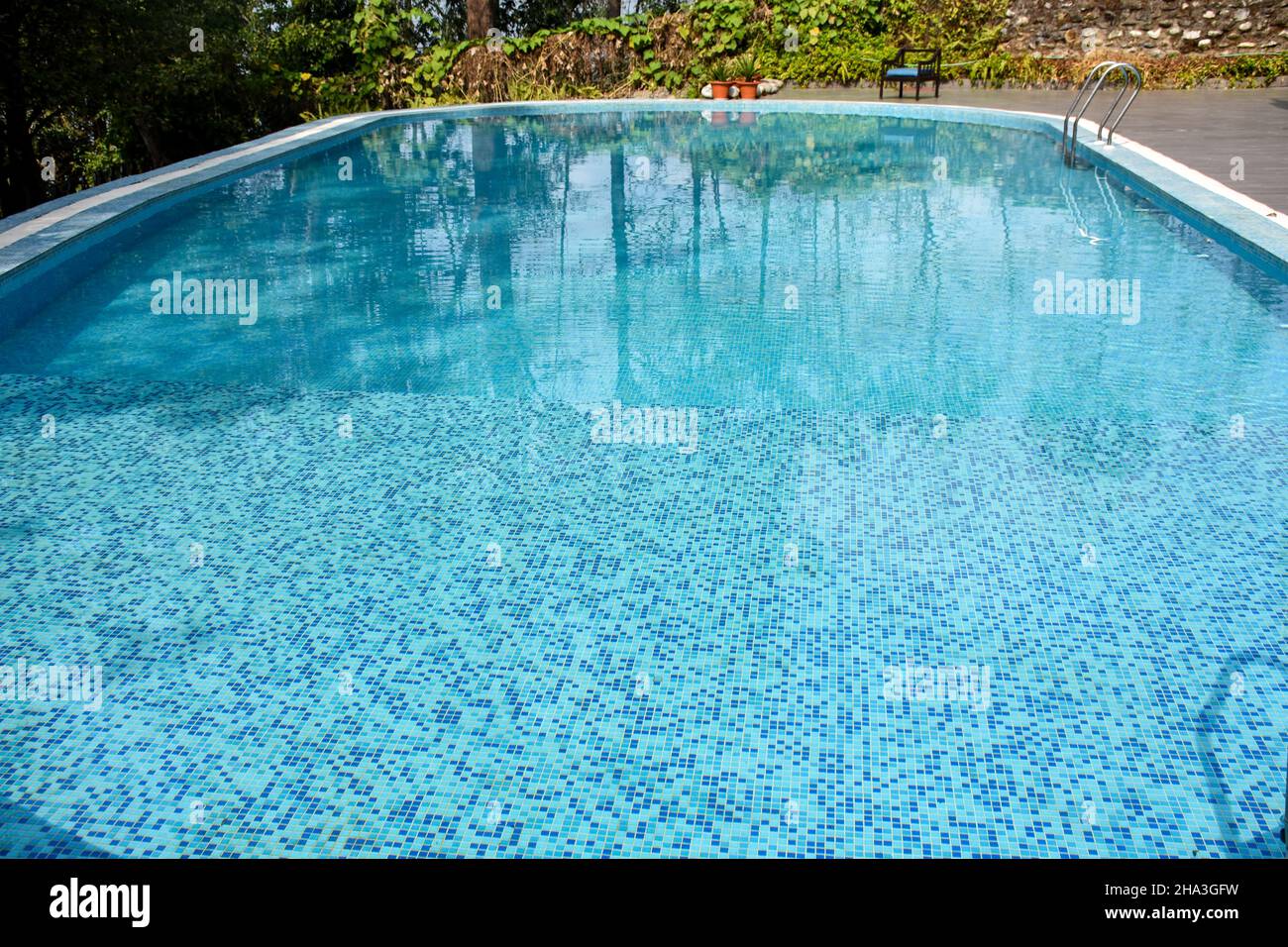 Swimming pool with blue and clear water Stock Photo - Alamy