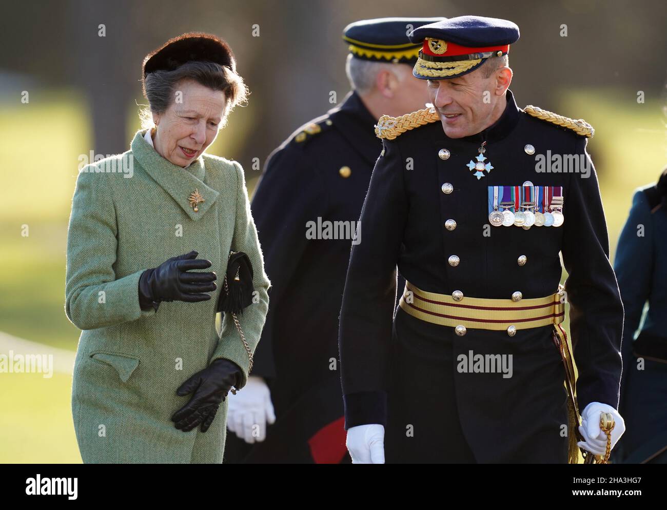 The Princess Royal (left), representing the Queen as the Reviewing Officer arrives for the Sovereign's Parade at the Royal Military Academy Sandhurst (RMAS) in Camberley. The parade marks the completion of 44 weeks of intensive training for the Officer Cadets of Commissioning Course 211 all of whom will officially hold the Queen's Commission at the stroke of midnight on the day of the parade. In addition, there are 35 international cadets from 26 countries including: Armenia, Ethiopia, Morocco, Montenegro, Iraq and Uruguay. Picture date: Friday December 10, 2021. Stock Photo