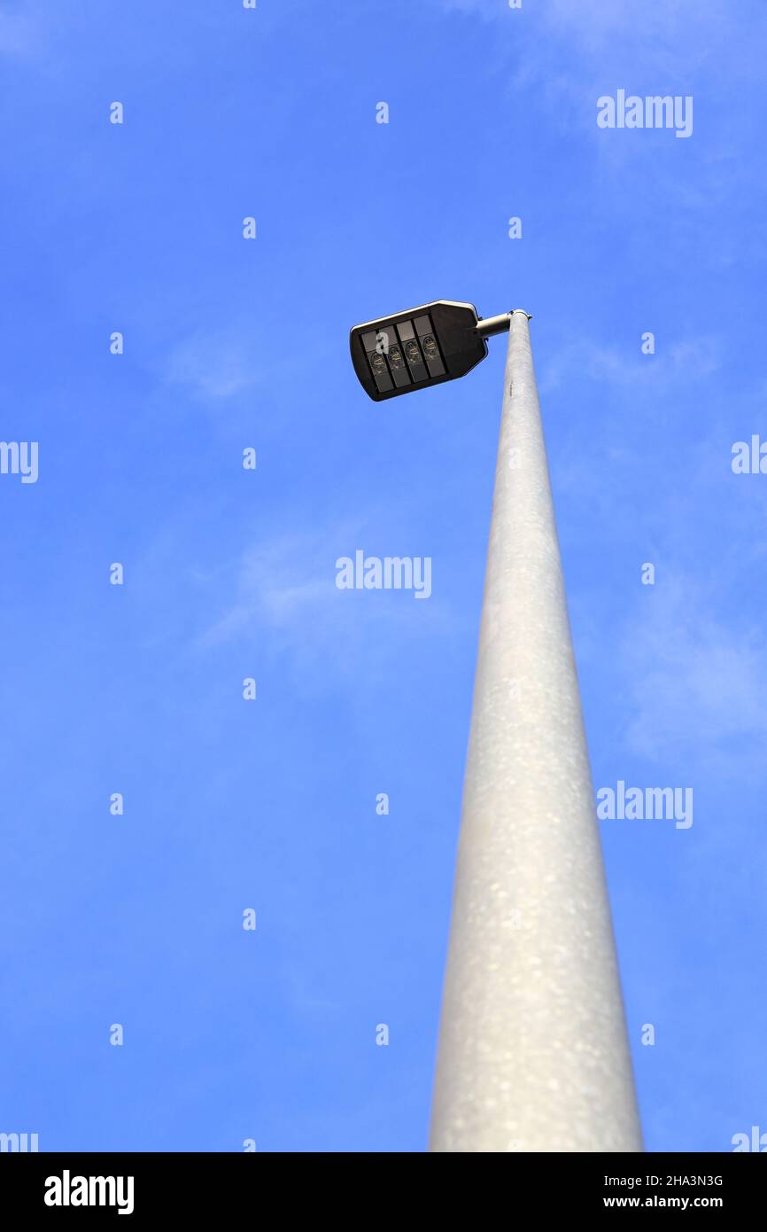 The modern LED electric light pole background with blue sky Stock Photo