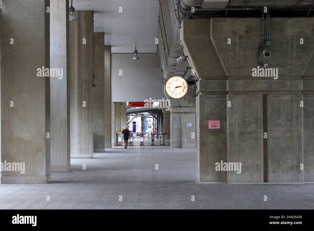 Pedestrian pathway or corridor or hallway between train station and other building. Stock Photo