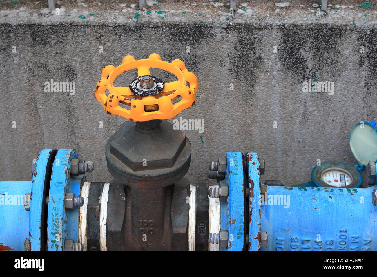 close up yellow water valve, Outdoor main water shut-off valve system. Stock Photo