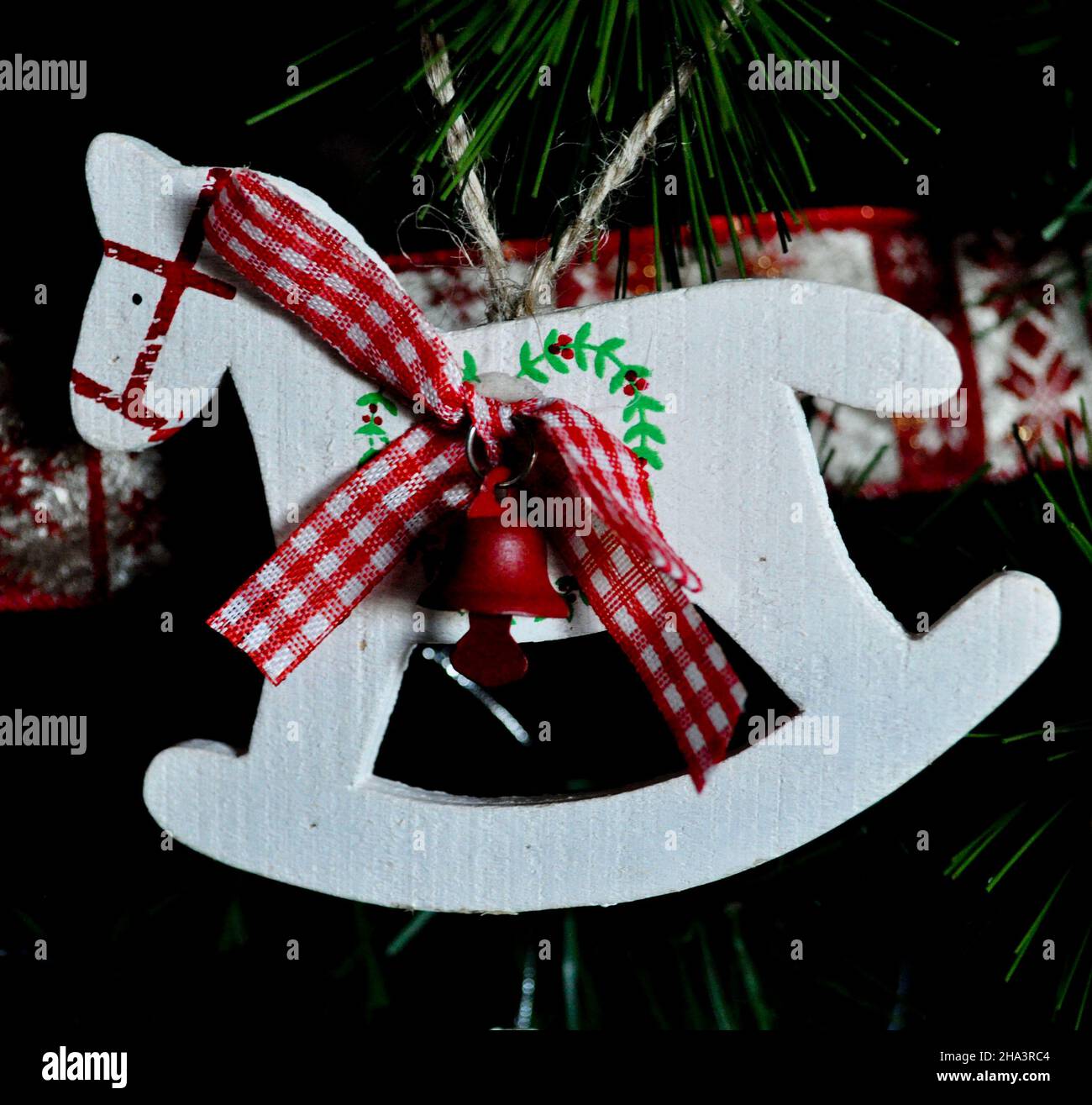 A simple wooden rocking horse Christmas Tree decoration Stock Photo