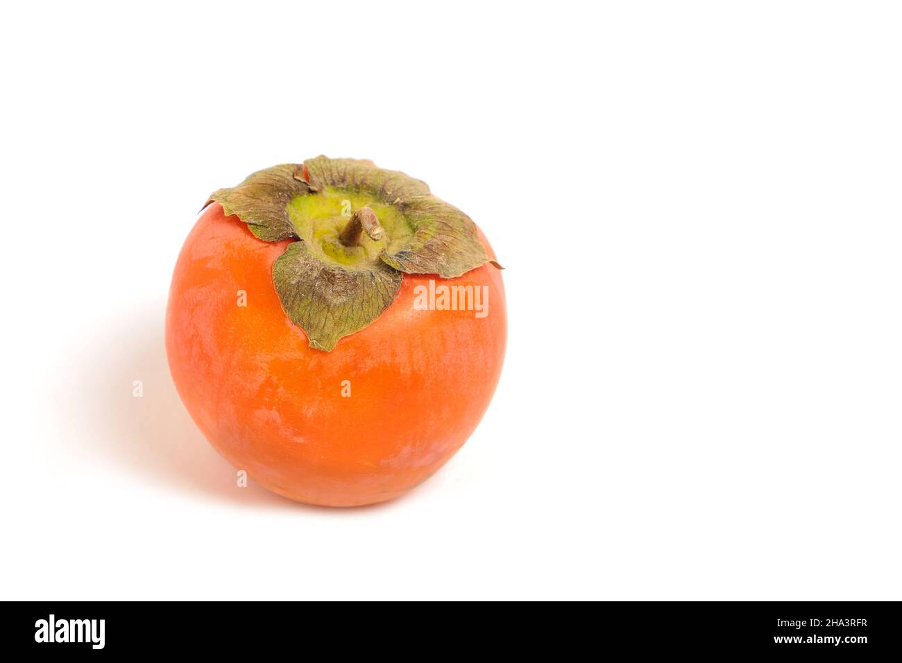 Ripe and bright persimmon fruit on white background Stock Photo