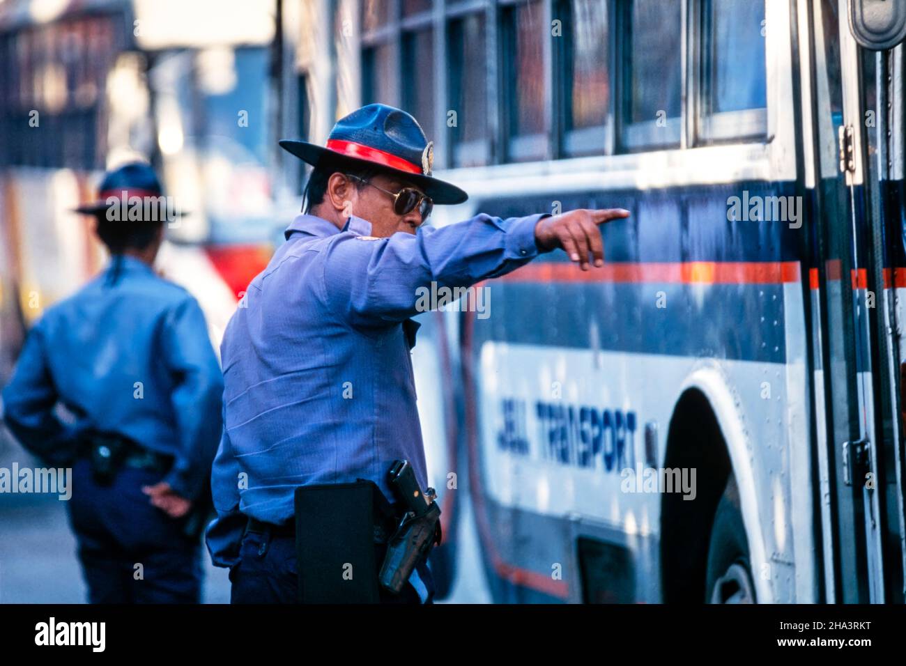 Police officers controlling trafic in city centre, Makati, Manila, Philippines Stock Photo