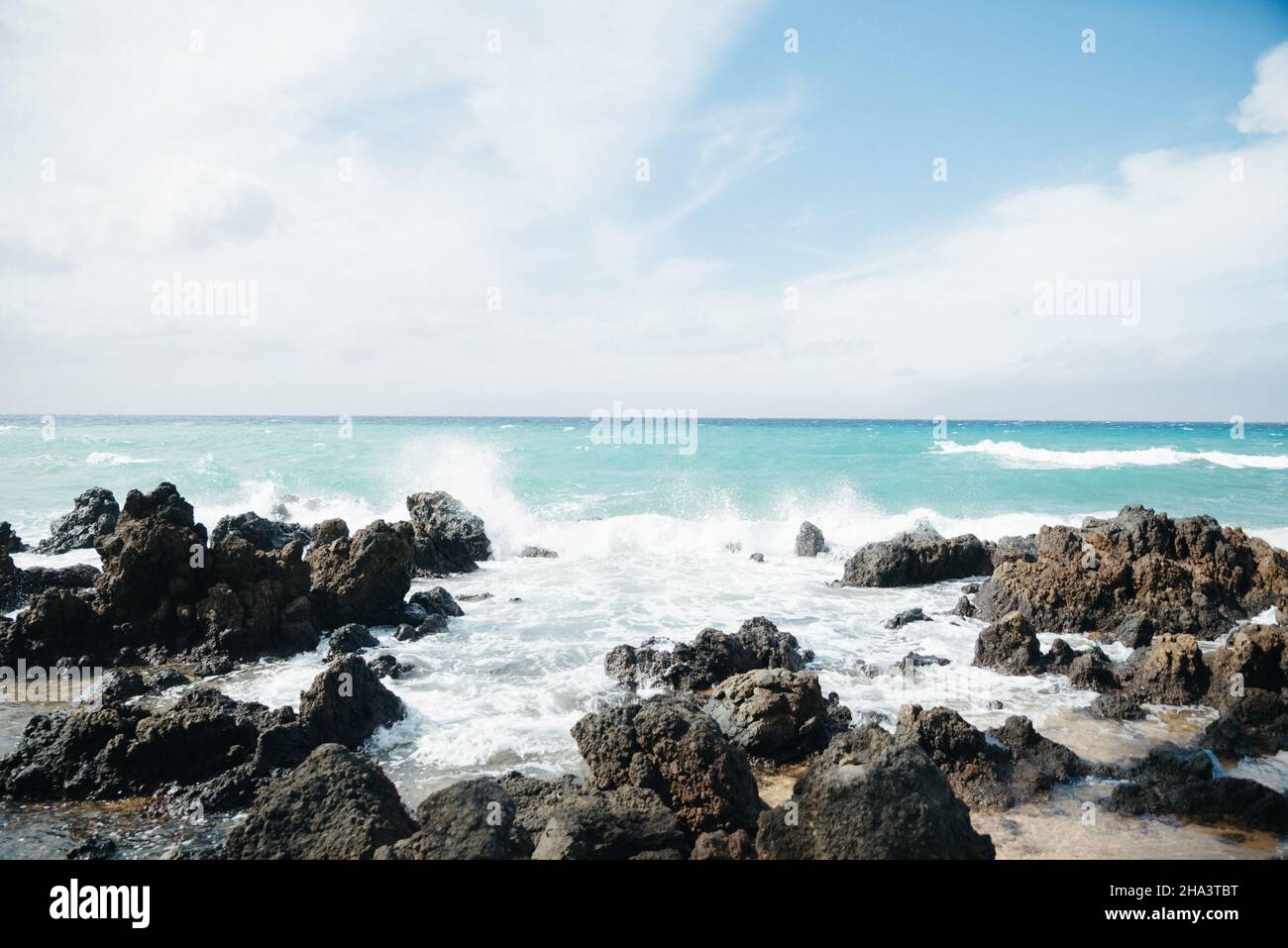 Oceanfront Rocks Beautiful shot of oceanfront with rocks and waves in Maui Stock Photo ...