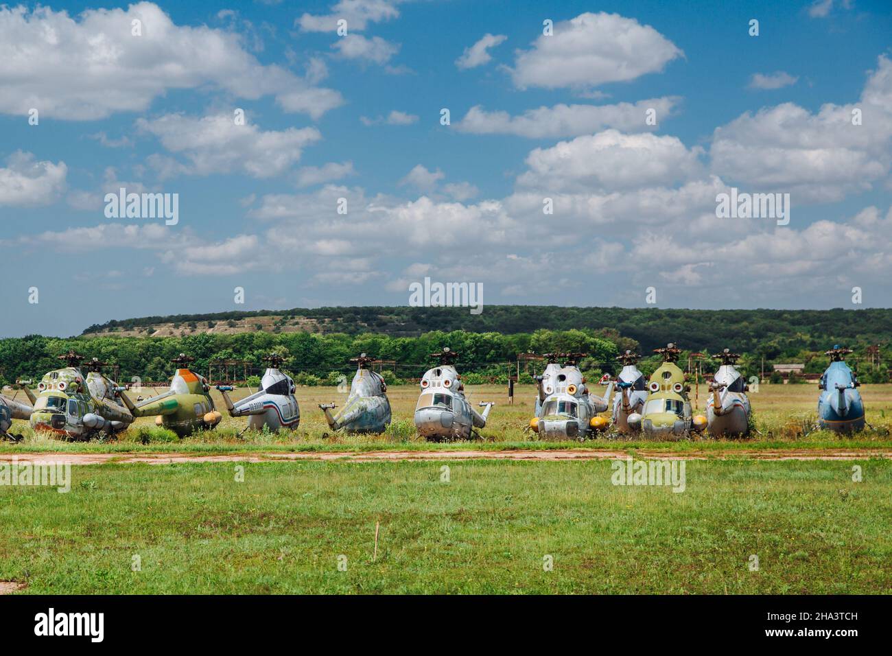 Old abandoned helicopters, broken non-working helicopters, cemetery of old helicopters.  Stock Photo