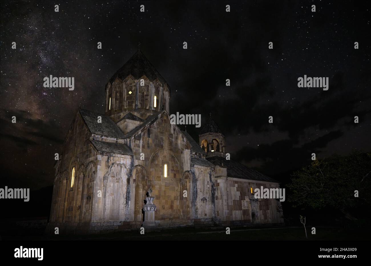 Nightscape view of a magnificent 13 c. Armenian apostolic cathedral, monastery Gandzasar, under stars with the Milky Way galaxy in the backgroun Stock Photo