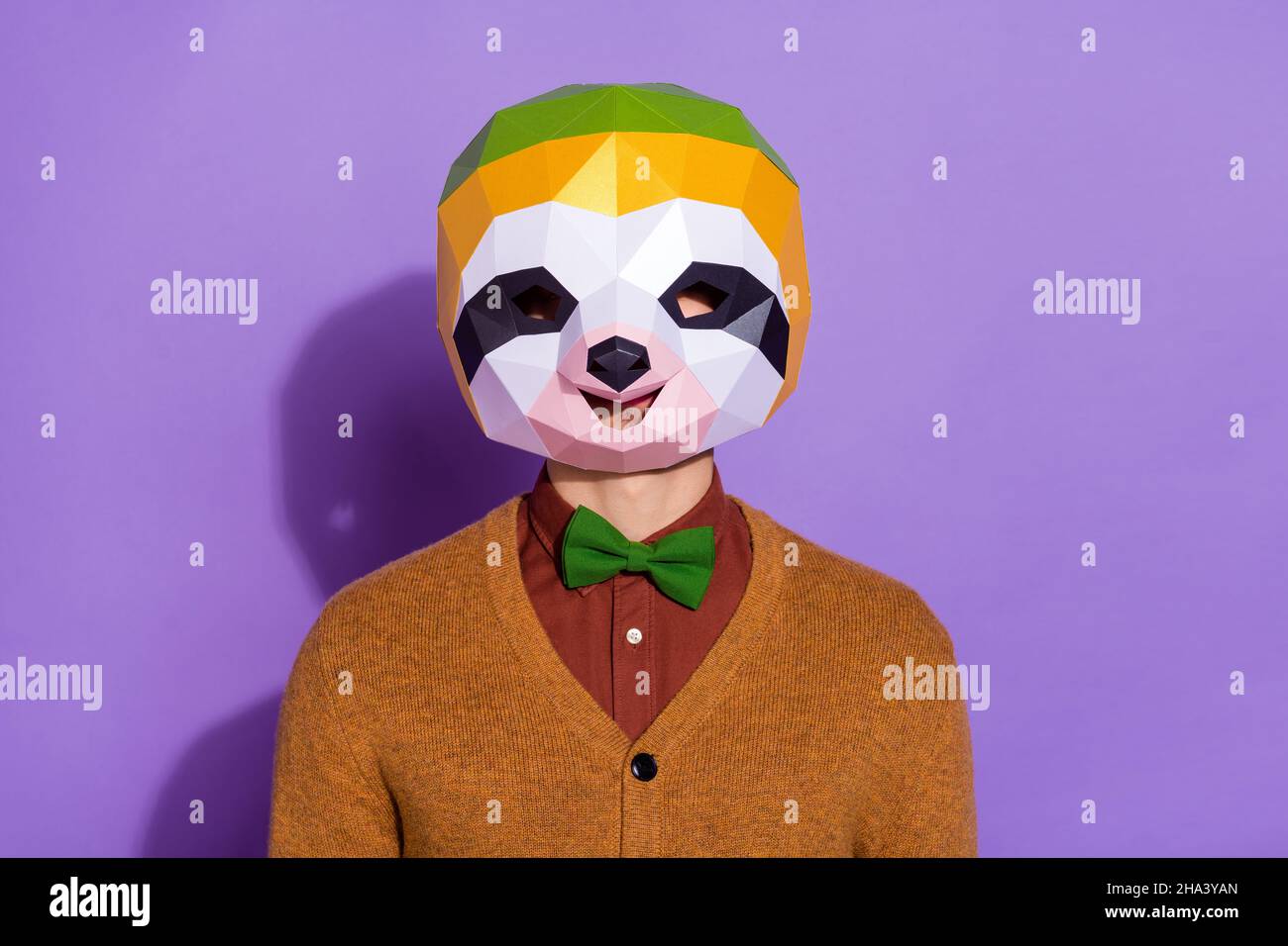 Photo of young guy wear mask incognito show performance wear modern outfit  red panda isolated over purple color background Stock Photo - Alamy