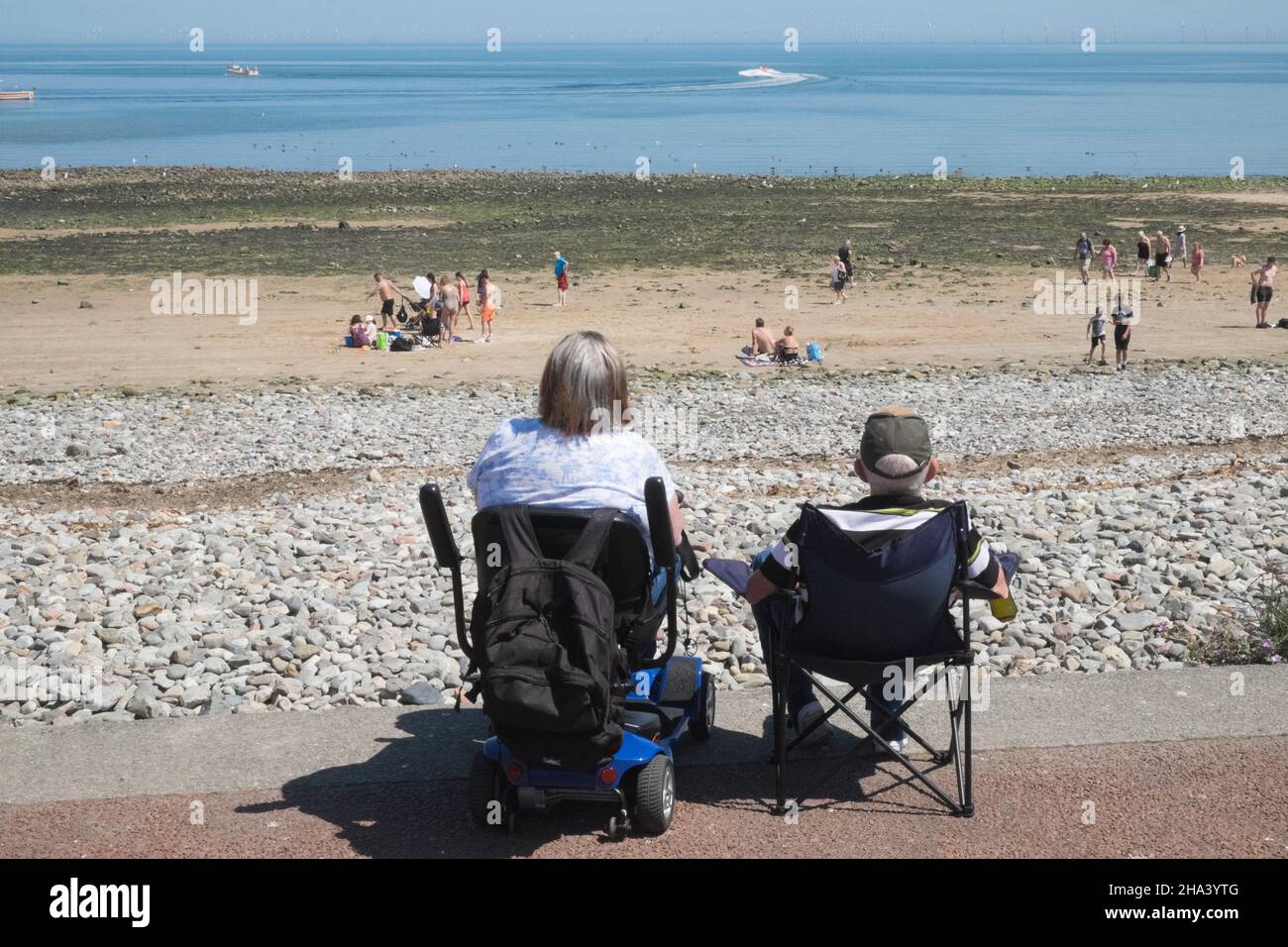 Mobility scooter, mobility scooters,and,camping chair,couple,enjoying