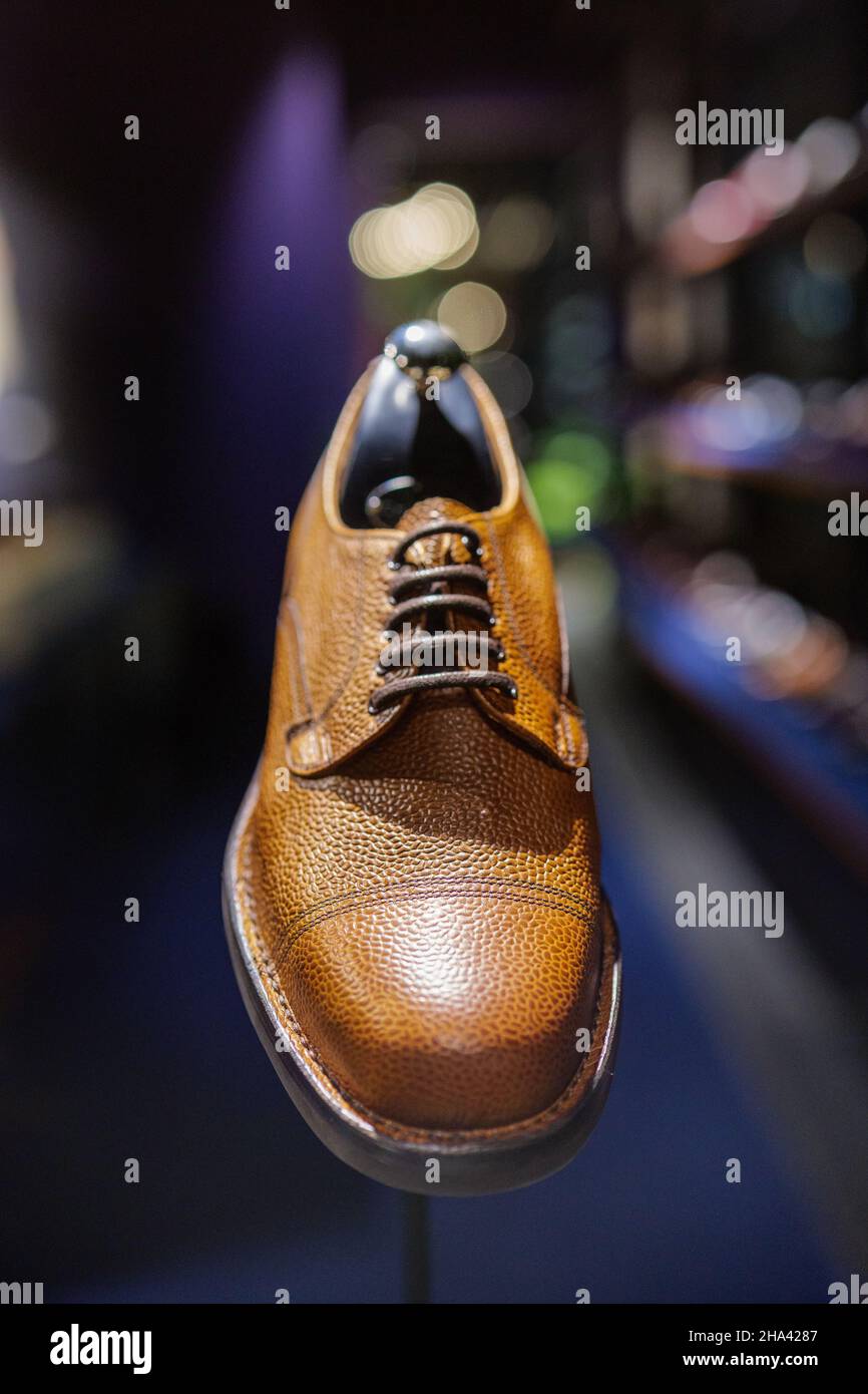 Brown leather shoe on display at a men's shoe shop called Joseph