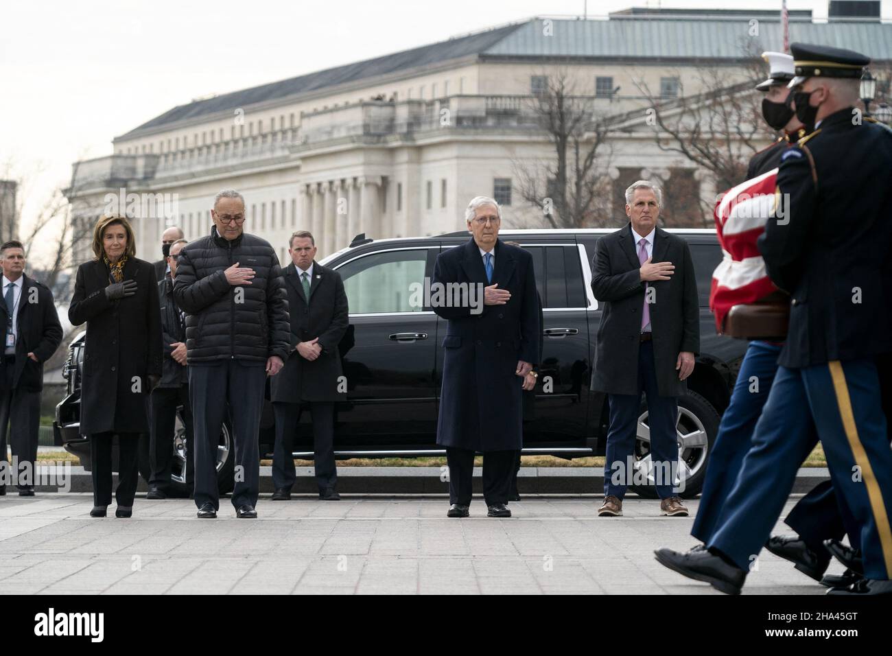 Washington DC, USA. 10th Dec 2021. Speaker Nancy Pelosi (D-Calif.), Majority Leader Charles Schumer (D-N.Y.), Minority Leader Mitch McConnell (R-Ky.) and House Minority Leader Kevin McCarthy (R-Calif.) watch a military honor guard carries the casket of Sen. Bob Dole (R-Kan.) after lying in state at the U.S. Capitol in Washington, DC, on Friday, December 10, 2021. Dole will be taken to Washington National Cathedral for a funeral service. Photo by Greg Nash/Pool/ABACAPRESS.COM Credit: Abaca Press/Alamy Live News Stock Photo