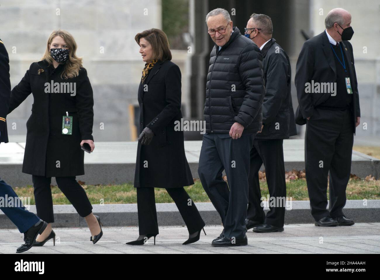 Washington DC, USA. 10th Dec 2021. Speaker Nancy Pelosi (D-Calif.) and Majority Leader Charles Schumer (D-N.Y.) are seen before a military honor guard carries the casket of Sen. Bob Dole (R-Kan.) after lying in state at the U.S. Capitol in Washington, DC, on Friday, December 10, 2021. Dole will be taken to Washington National Cathedral for a funeral service. Photo by Greg Nash/Pool/ABACAPRESS.COM Credit: Abaca Press/Alamy Live News Stock Photo