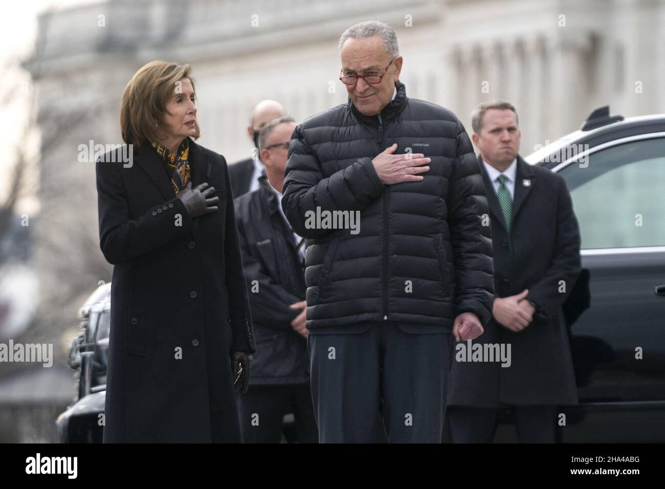 Washington DC, USA. 10th Dec 2021. Speaker Nancy Pelosi (D-Calif.) and House Majority Leader Charles Schumer (D-N.Y.) watch a military honor guard carries the casket of Sen. Bob Dole (R-Kan.) after lying in state at the U.S. Capitol in Washington, DC, on Friday, December 10, 2021. Dole will be taken to Washington National Cathedral for a funeral service. Photo by Greg Nash/Pool/ABACAPRESS.COM Credit: Abaca Press/Alamy Live News Stock Photo