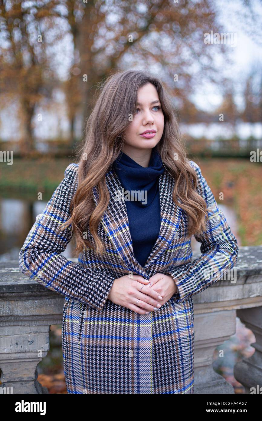 Blond woman in trench coat hi-res stock photography and images - Alamy