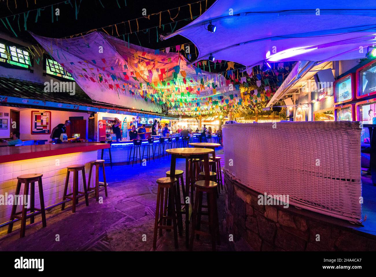 Buzios, Brazil - July 24, 2018: Interior of bar and restaurant with colorful lights at night. Stock Photo