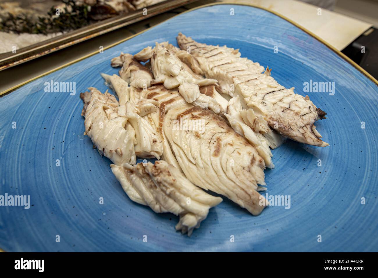 Cooked Fish In Plate Closeup shot of cooked fish served in a plate Stock Photo - Alamy