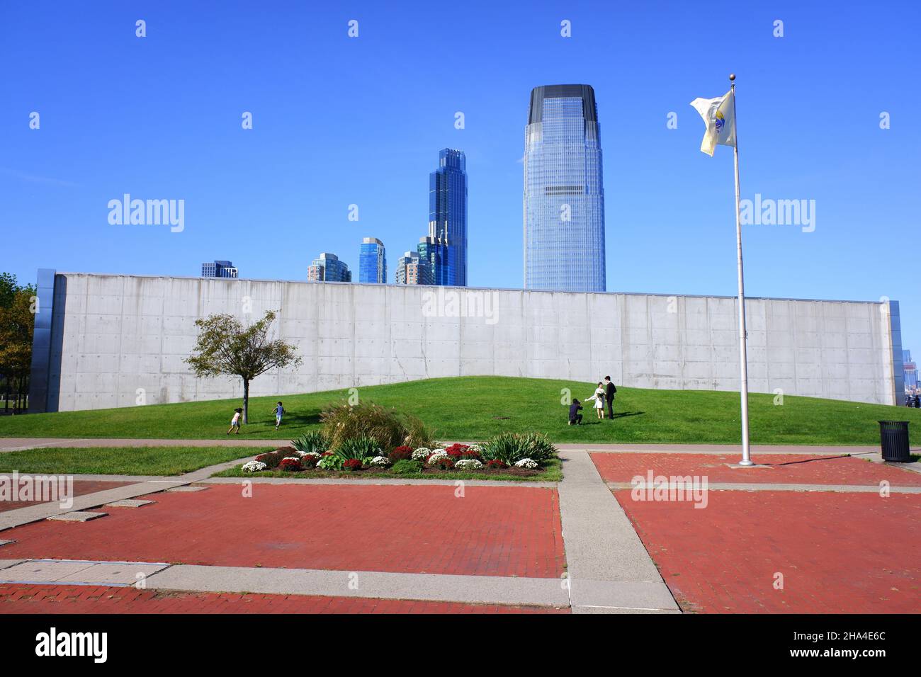 The Empty Sky NJ 9/11 Memorial in Liberty State Park with Goldman Sachs Tower in Jersey City in the background.New jersey.USA Stock Photo