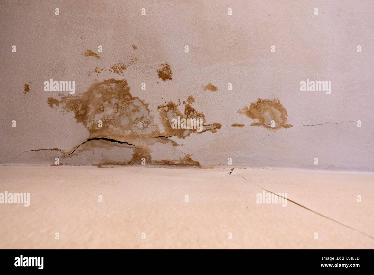 Brown stains on the ceiling in a residential building. Defective sewage