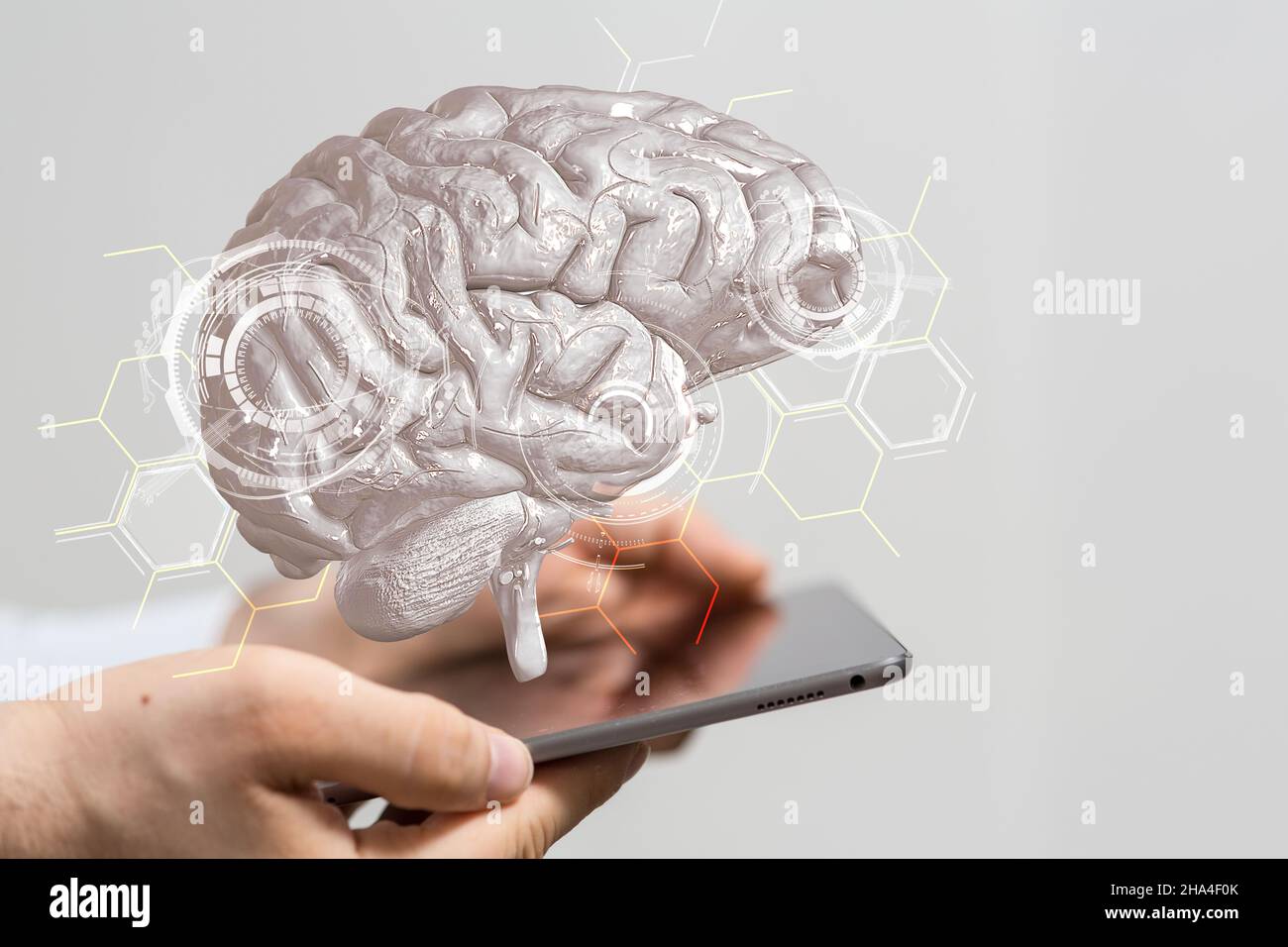 3D rendering of a human brain icon floating on man's tablet ...