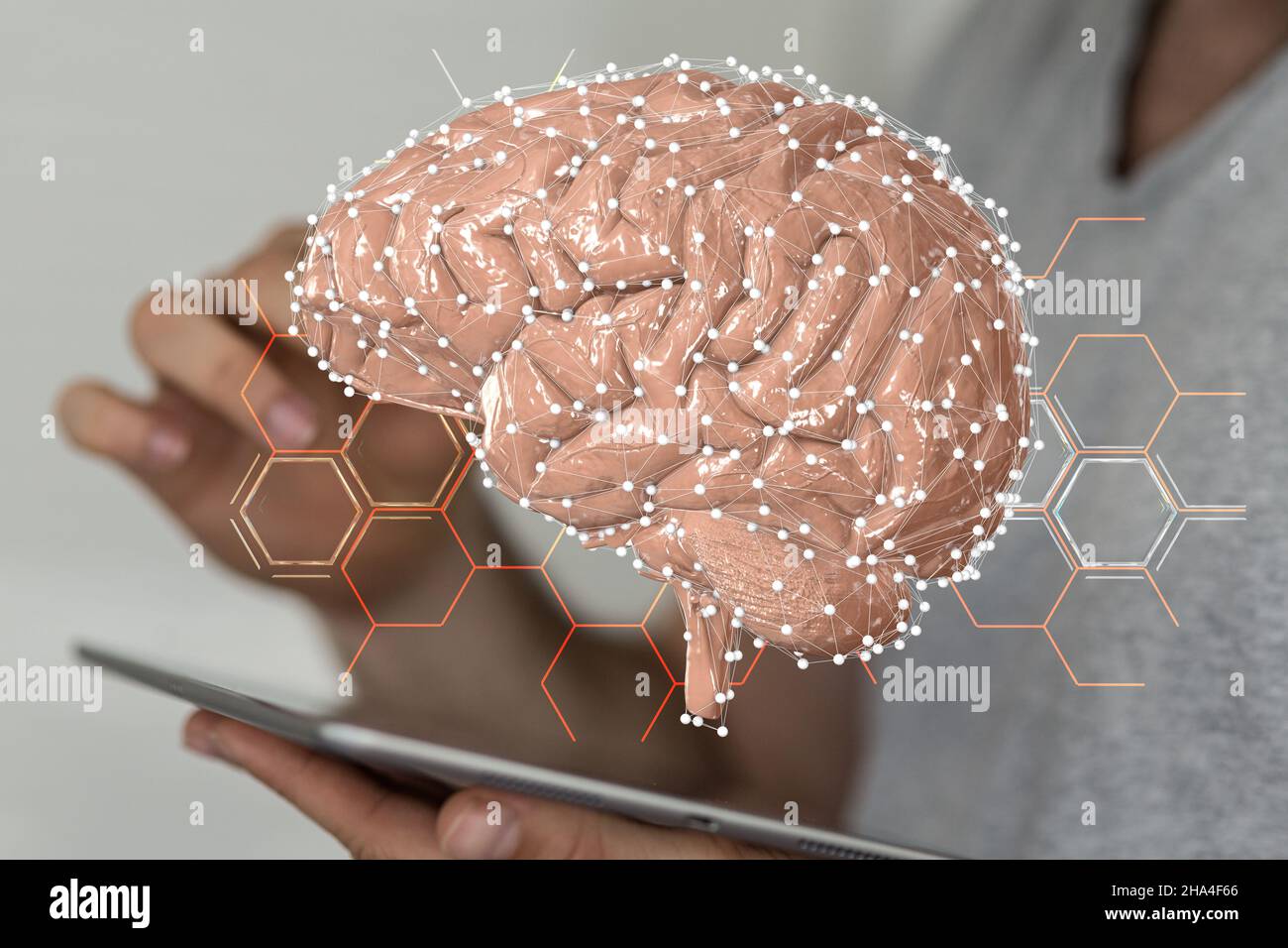 3D rendering of a human brain icon floating on man's tablet ...