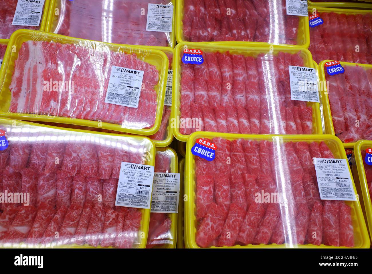 Pre sliced meat for hot pot for sale in the meat department in Lotte Plaza Market an Asian Korean supermarket in Edison, New Jersey.USA Stock Photo