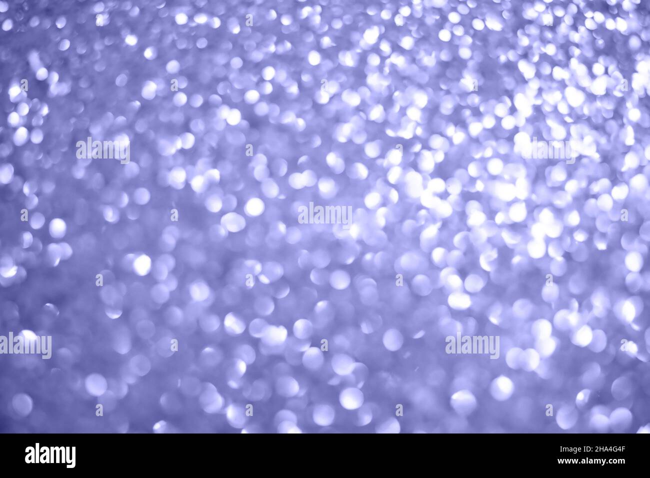 Brilliant background color of the year 2022 with silver Christmas texture, abstract light of sparkling stars on the side. High quality photo Stock Photo