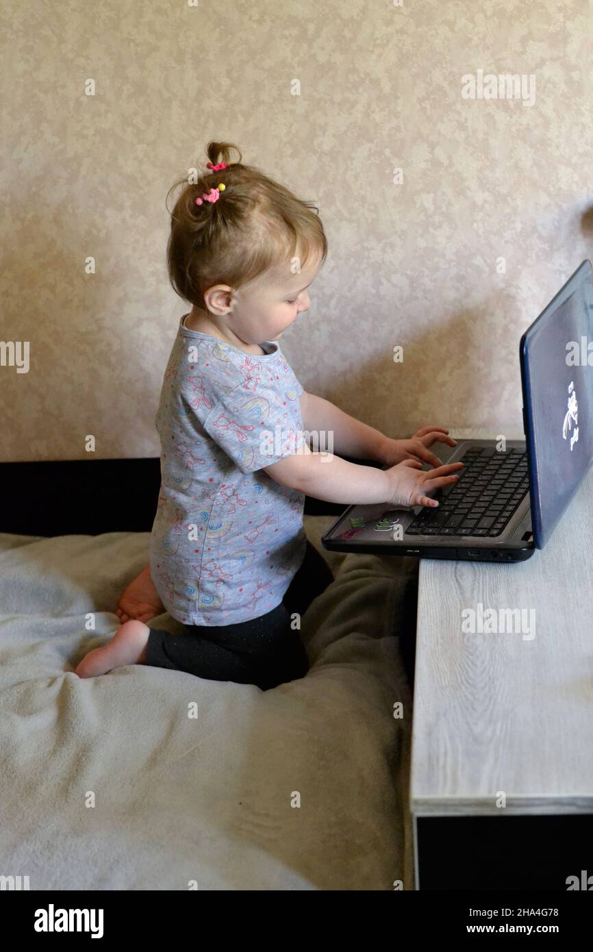 little cleaver girl using laptop Stock Photo - Alamy