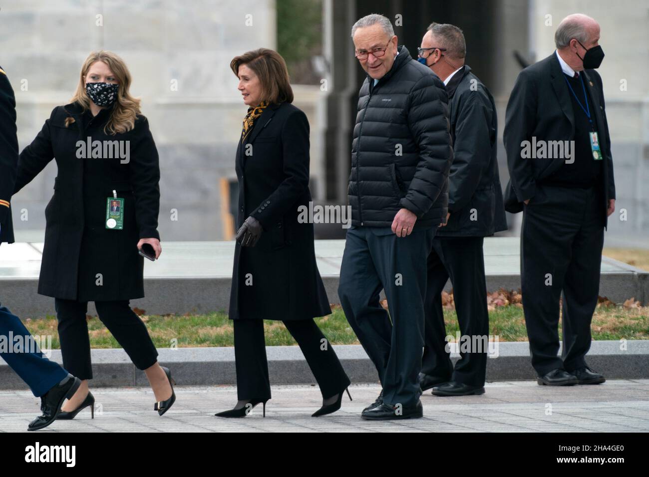 Washington, USA. 10th Dec, 2021. Speaker Nancy Pelosi (D-Calif.) and Majority Leader Charles Schumer (D-N.Y.) are seen before a military honor guard carries the casket of Sen. Bob Dole (R-Kan.) after lying in state at the U.S. Capitol in Washington, DC, on Friday, December 10, 2021. Dole will be taken to Washington National Cathedral for a funeral service. (Photo by Greg Nash/Pool/Sipa USA) Credit: Sipa USA/Alamy Live News Stock Photo