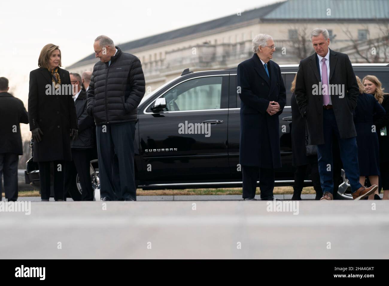 Speaker Nancy Pelosi (D-Calif.), Majority Leader Charles Schumer (D-N.Y.), Minority Leader Mitch McConnell (R-Ky.) and House Minority Leader Kevin McCarthy (R-Calif.) are seen before a military honor guard carries the casket of Sen. Bob Dole (R-Kan.) after lying in state at the U.S. Capitol in Washington, D.C., on Friday, December 10, 2021. Dole will be taken to Washington National Cathedral for a funeral service. (Photo by Greg Nash/Pool/Sipa USA) Stock Photo