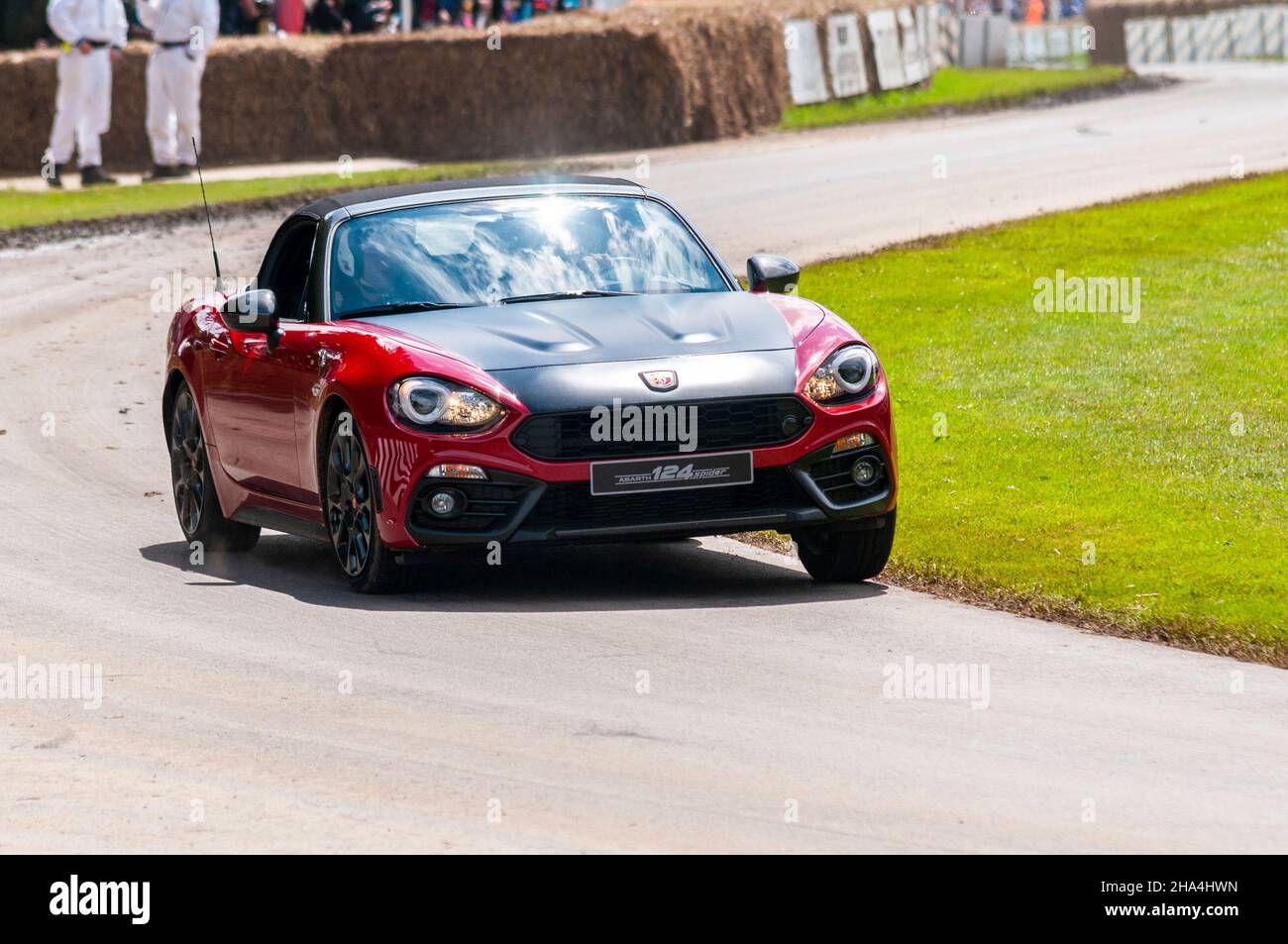 Fiat Abarth 124 Spider sports car driving up the hill climb track at