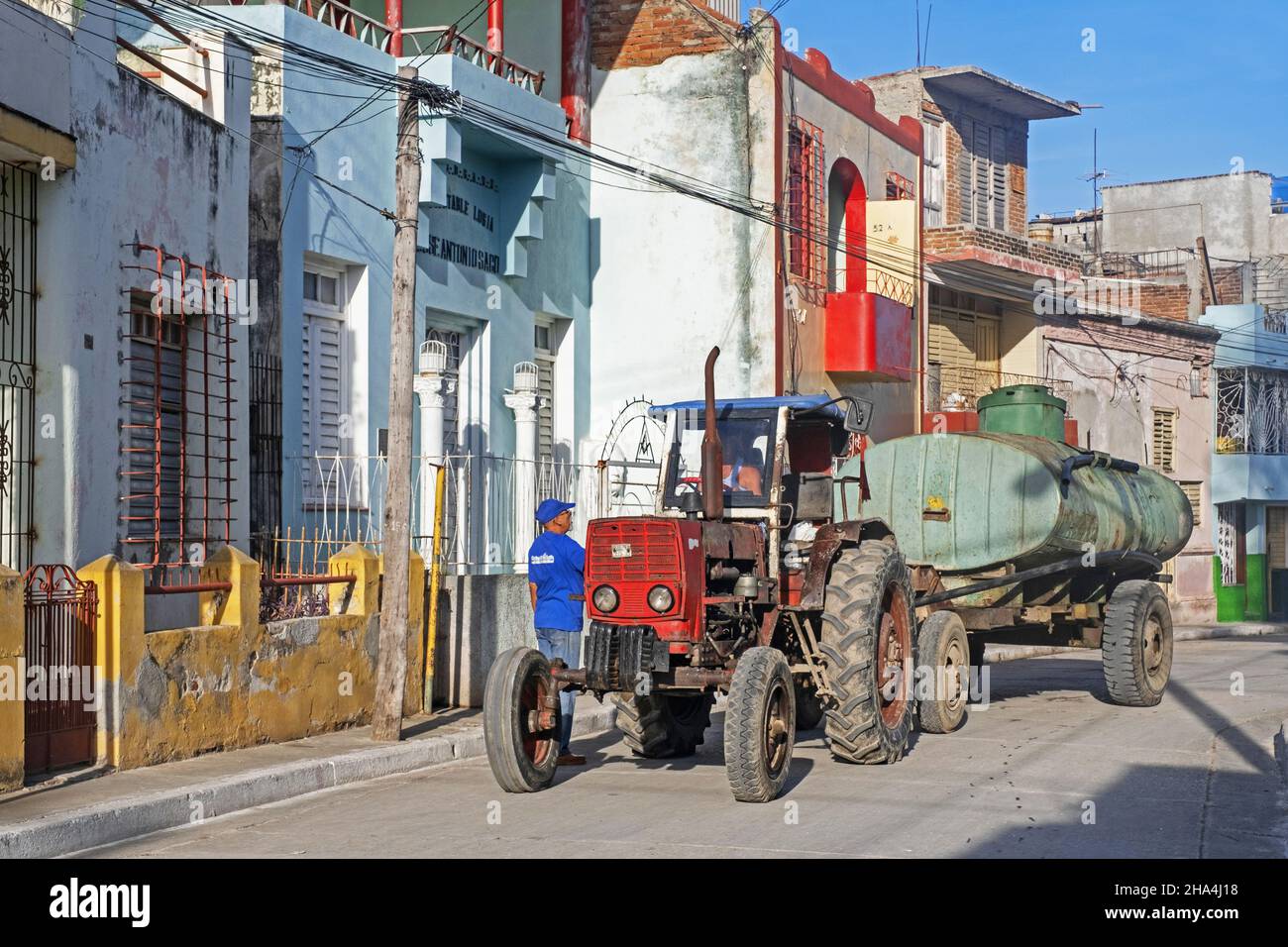 Tractor with trailer for emptying septic tanks / cesspits on the street in the city Bayamo, Granma Province, Oriente region on island Cuba, Caribbean Stock Photo
