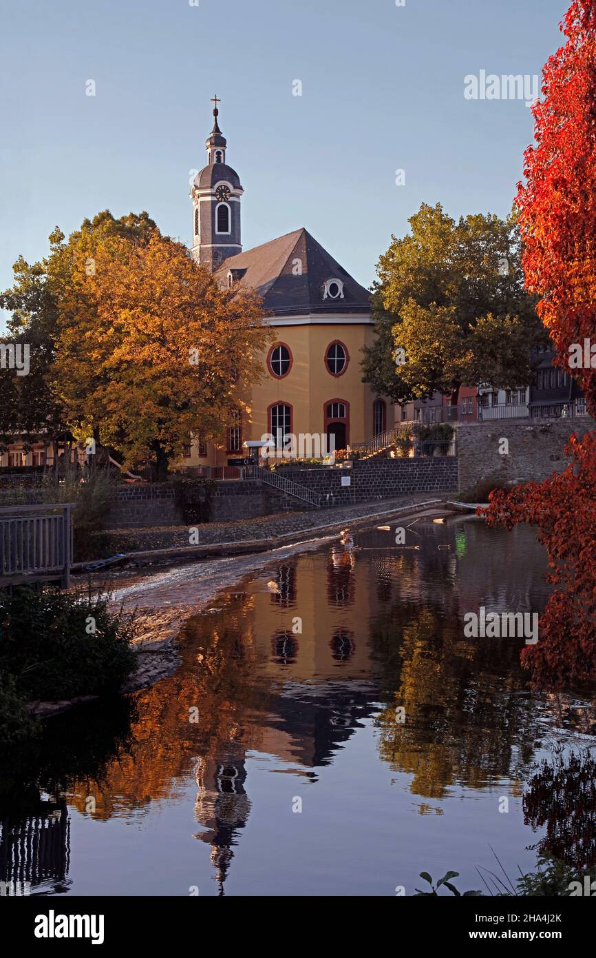 hospital church,river lahn,water reflection,autumn,wetzlar,hesse,germany Stock Photo