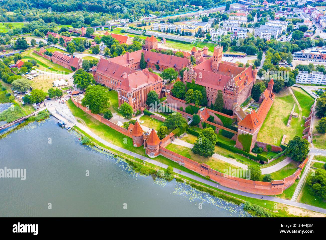 Medieval Malbork (Marienburg) Castle in Poland, main fortress of the Teutonic Knights at the Nogat river. Aerial skyline view of the city in fall in s Stock Photo