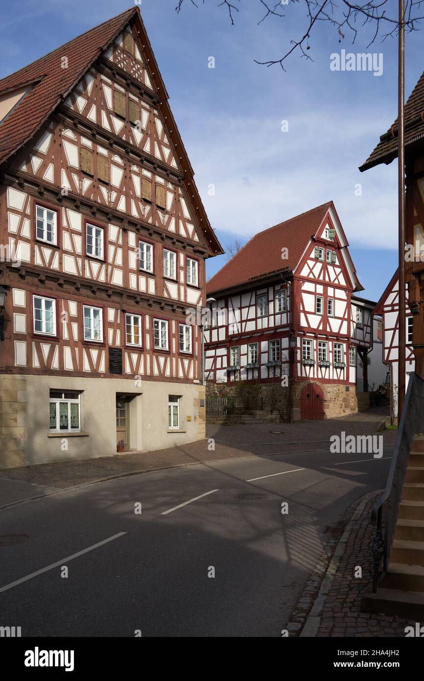 Two historical half-timbered houses (Fachwerkhaus) on the street edge. Germany, Weinstadt. Stock Photo