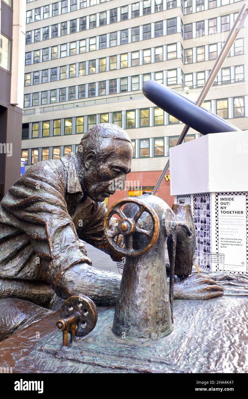 The Garment Worker sculpture by Judith Weller at 7th Avenue.Garment District.Midtown Manhattan, New York City, USA Stock Photo
