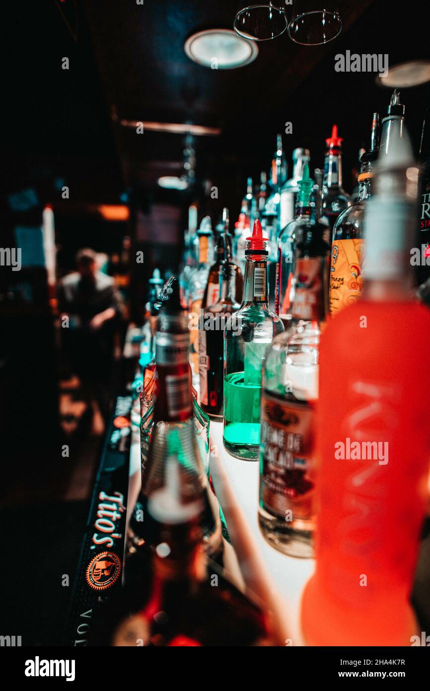 EVERETT, UNITED STATES - May 04, 2019: A vertical shot of the alcohol drink bottles in the bar Stock Photo
