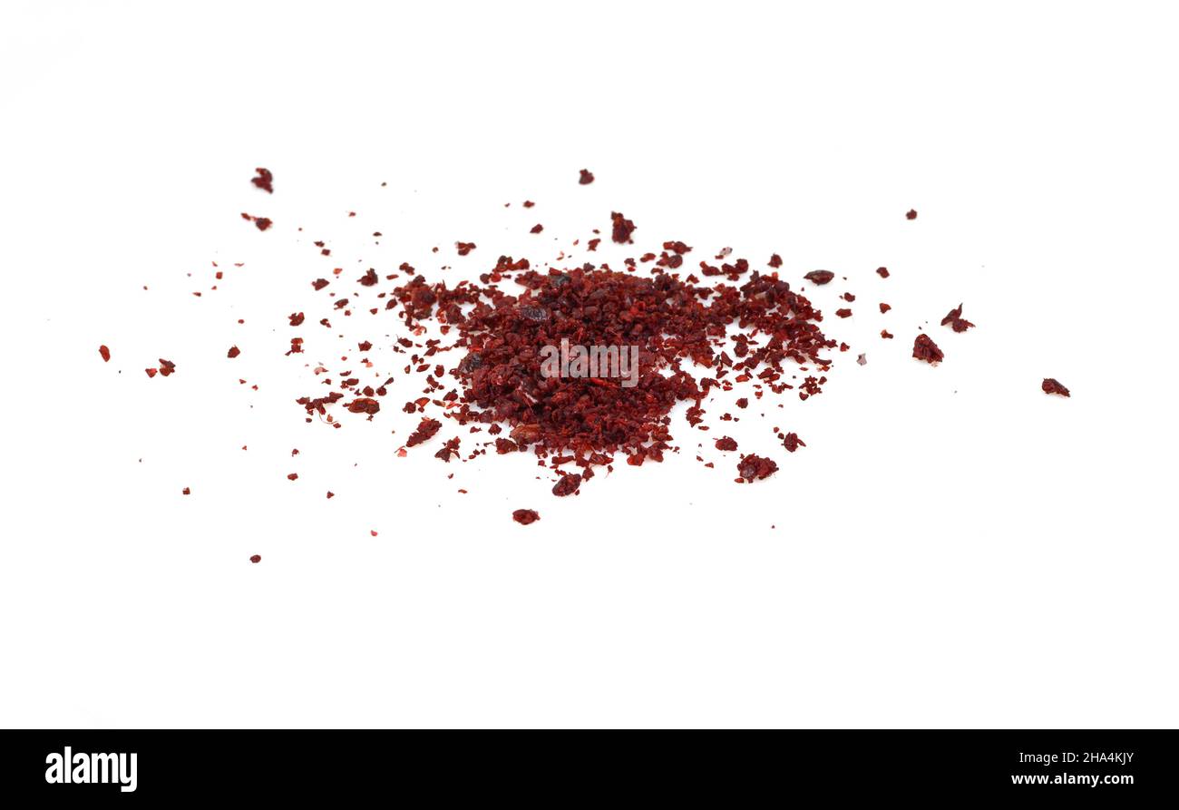 Sumac spice on white. Ground Sumac Powder Spice isolated Stock Photo