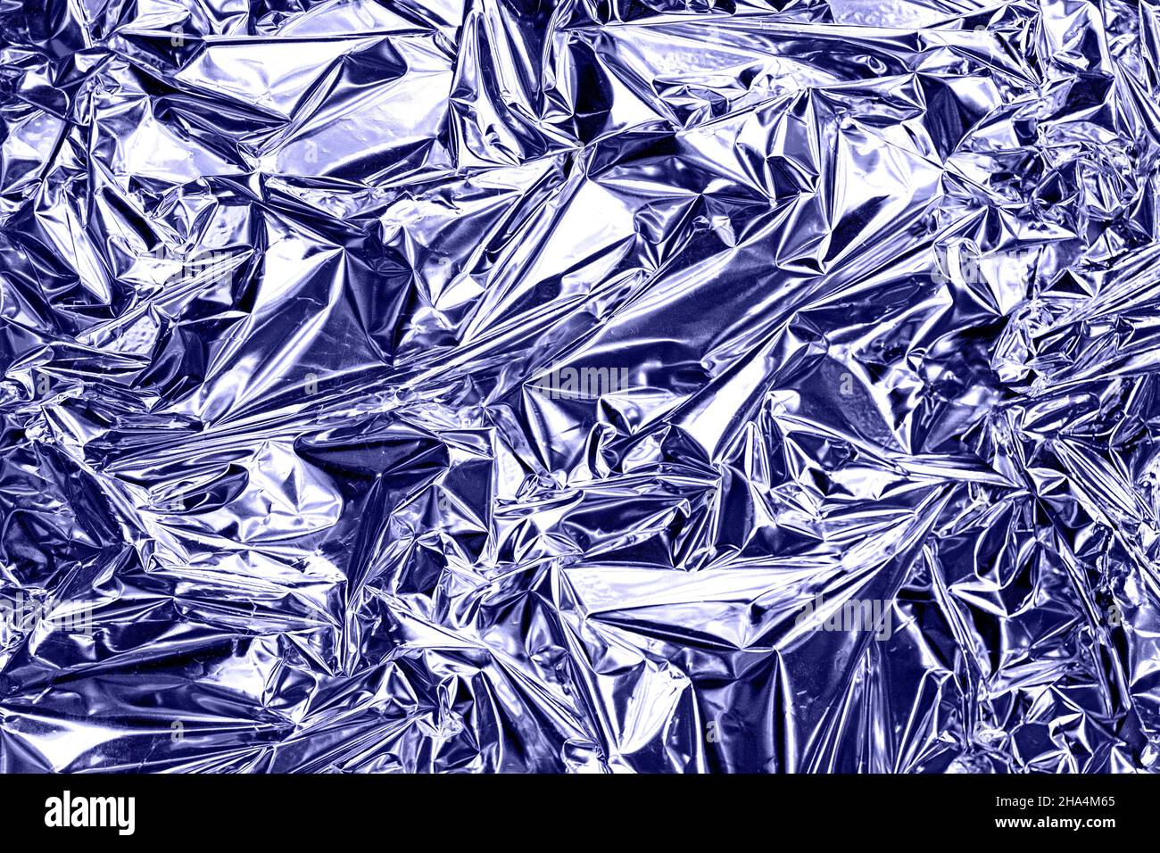 Modern beautiful holographic wrinkled foil background Stock Photo - Alamy