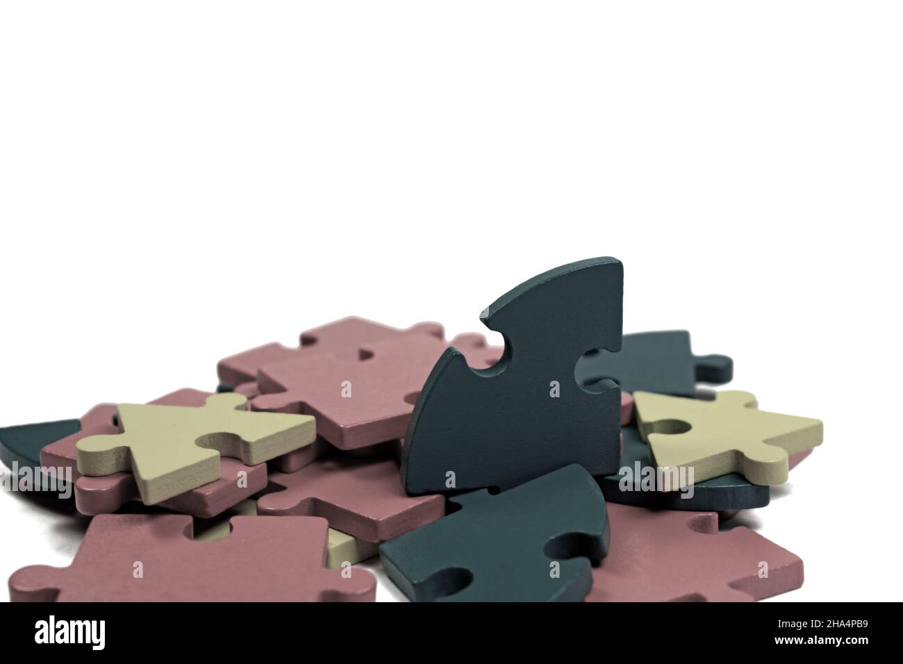 Colorful wooden puzzle pieces against white background Stock Photo - Alamy