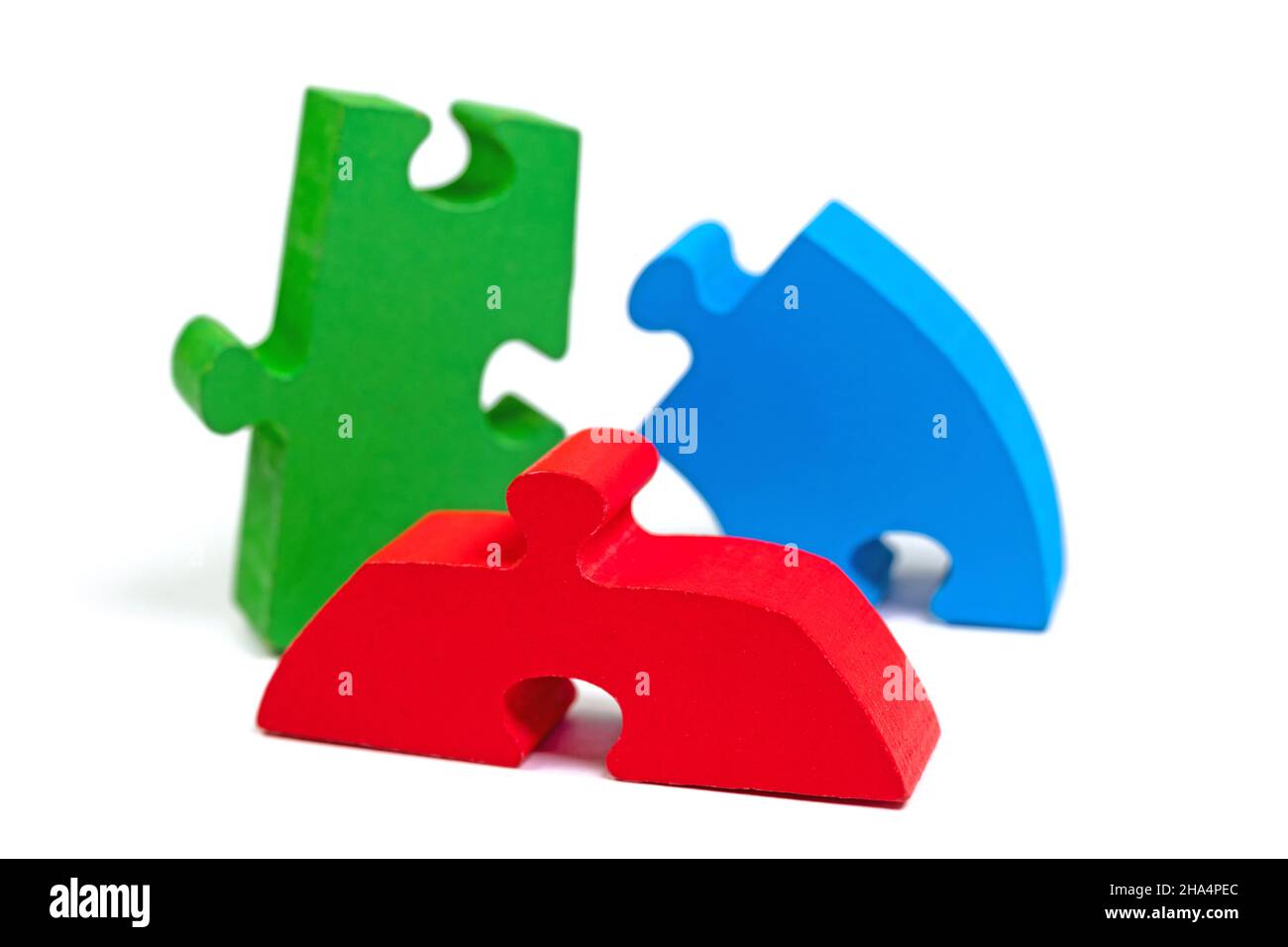 Colorful wooden puzzle pieces against white background Stock Photo - Alamy