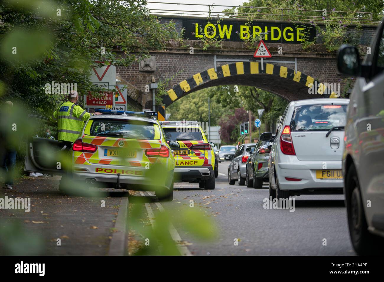 Warwickshire Police and West Midlands Ambulance Service at a low bridge strike in Leamington Spa Stock Photo
