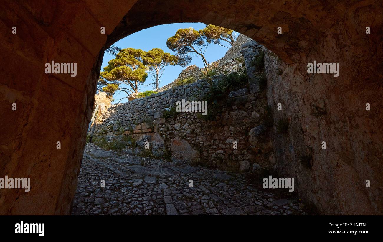greece,greek islands,ionian islands,kefalonia,agios georgios castle complex,byzantine,16th century,capital kefalonia until 1757,nice weather,blue sky without clouds,view through the entrance tunnel to the walls and trees on them Stock Photo