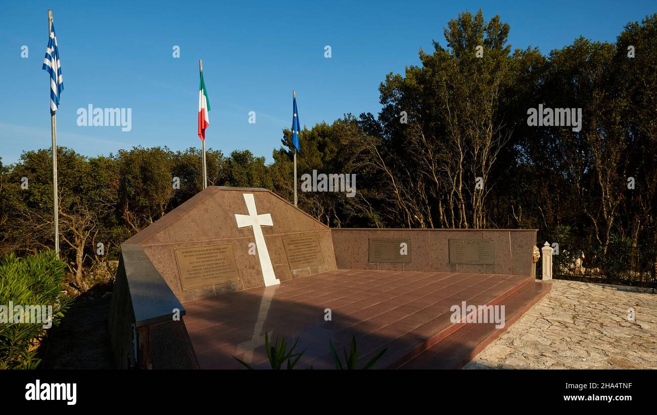 greece,greek islands,ionian islands,kefalonia,north of argostoli,memorial,italian acqui division,nazi massacre,september 1943,national flags of greece and italy and the eu behind the memorial Stock Photo